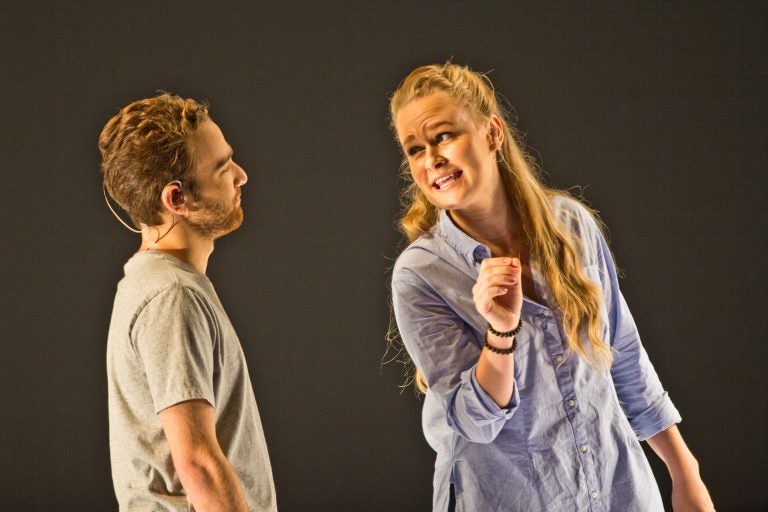 Theo Huffman and Siena Licht Miller perform in Denis and Katya, playing multiple characters examining the aftermath of two teenagers that live-streamed the events that led up to their deaths. (Kimberly Paynter/WHYY)