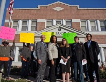 Protestors and city officials gather outside the DELCORA building in Chester to protest the Delaware County Regional Water Authority’s deal with Aqua America, Inc. (Kimberly Paynter/WHYY)