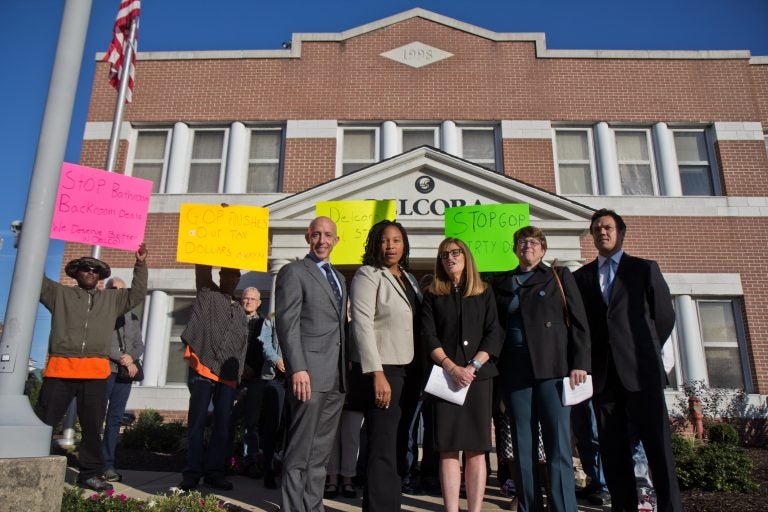 Protestors and city officials gather outside the DELCORA building in Chester to protest the Delaware County Regional Water Authority’s deal with Aqua America, Inc. (Kimberly Paynter/WHYY)