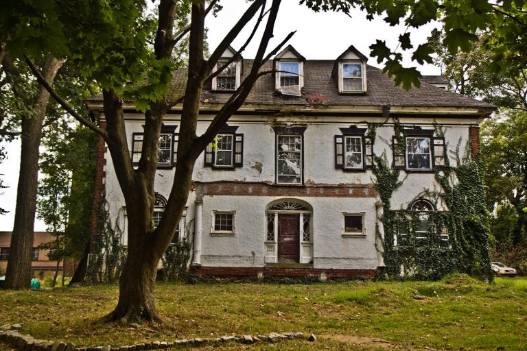 A historic home in need of repair on Upland Way in Overbrook. (Kimberly Paynter/WHYY)