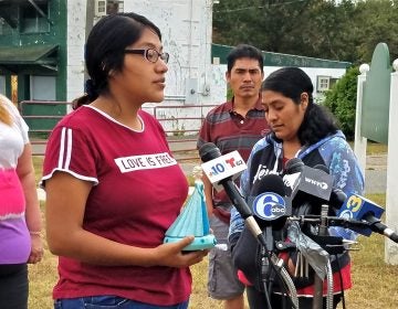 Noema Alavez Perez (left), mother of missing 5-year-old Dulce Maria Alavez, holds her daughter's favorite toy as she speaks to reporters at the Bridgeton City Park.  She is accompanied by her mother, Norma Perez (right). (Nicholas Pugliese/WHYY)