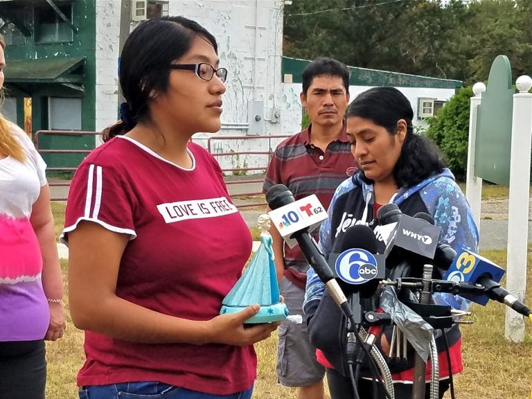 Noema Alavez Perez (left), mother of missing 5-year-old Dulce Maria Alavez, holds her daughter's favorite toy as she speaks to reporters at the Bridgeton City Park.  She is accompanied by her mother, Norma Perez (right). (Nicholas Pugliese/WHYY)