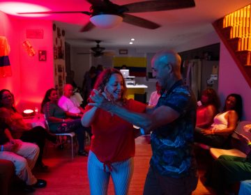 Liiana Acero dances with Eduardo Bru during the at-home vijoteca on Saturday, September 14, 2019. (Kriston Jae Bethell for WHYY)