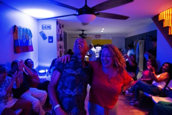 Liiana Acero dances with Eduardo Bru during the at-home vijoteca on Saturday, September 14, 2019. (Kriston Jae Bethell for WHYY)