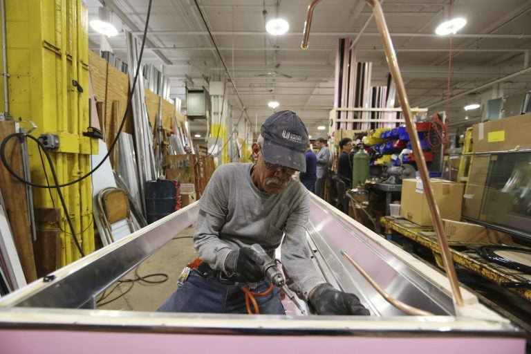 In this Thursday, Oct. 18, 2018, photo Luis Ramos works at the Howard McCray's commercial refrigeration manufacturing facility in Philadelphia. (Matt Rourke/AP Photo)