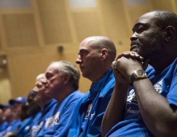Death row exonerees including Kwame Ajamu, (right), listens to speakers during a Witness to Innocence news conference marking the organization's 15th anniversary at the at the National Constitution Center in Philadelphia, Thursday, Nov. 15, 2018. (Matt Rourke/AP Photo)