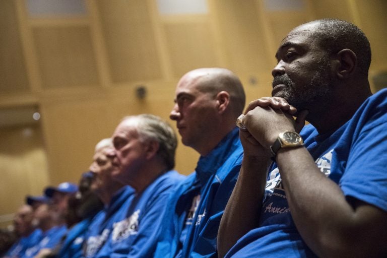 Death row exonerees including Kwame Ajamu, (right), listens to speakers during a Witness to Innocence news conference marking the organization's 15th anniversary at the at the National Constitution Center in Philadelphia, Thursday, Nov. 15, 2018. (Matt Rourke/AP Photo)