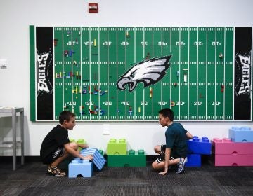 In this Thursday, Aug. 22, 2019, photo, 10-year-old twin brothers Ryan left, and Jack Ykoruk, play in the Lincoln Financial Field sensory room before a preseason NFL football game between the Philadelphia Eagles and the Baltimore Ravens in Philadelphia. (Matt Rourke/AP Photo)