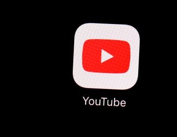 This March 20, 2018, file photo shows the YouTube app on an iPad in Baltimore. Google's video site YouTube has been fined $170 million to settle allegations it collected children's personal data without their parents' consent. (Patrick Semansky/AP Photo)