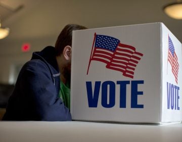 A voter fills out a provisional ballot by hand for the midterm elections at a polling place in Annapolis, Md., Tuesday, Nov. 4, 2014. (Carolyn Kaster/AP Photo)