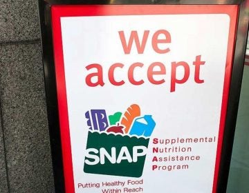A sign indicates a store that accepts the Supplemental Nutritional Assistance Program or SNAP, the official name of the food stamp program. (File photo/The Columbus Dispatch/TNS)