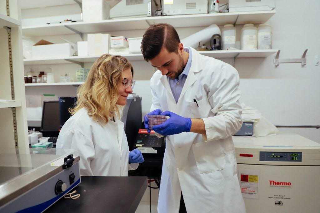 Co-founded Shannon Falconer and lead tissue scientist Taylor Books work in the lab together. (Photo provided by Because Animals.)
