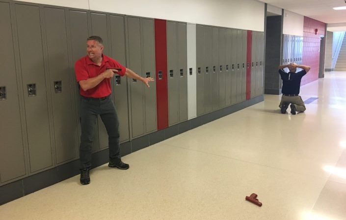 Andrew Blubagh runs a school shooter simulation at a high school in Ohio. (Jen Kinney for Keystone Crossroads)