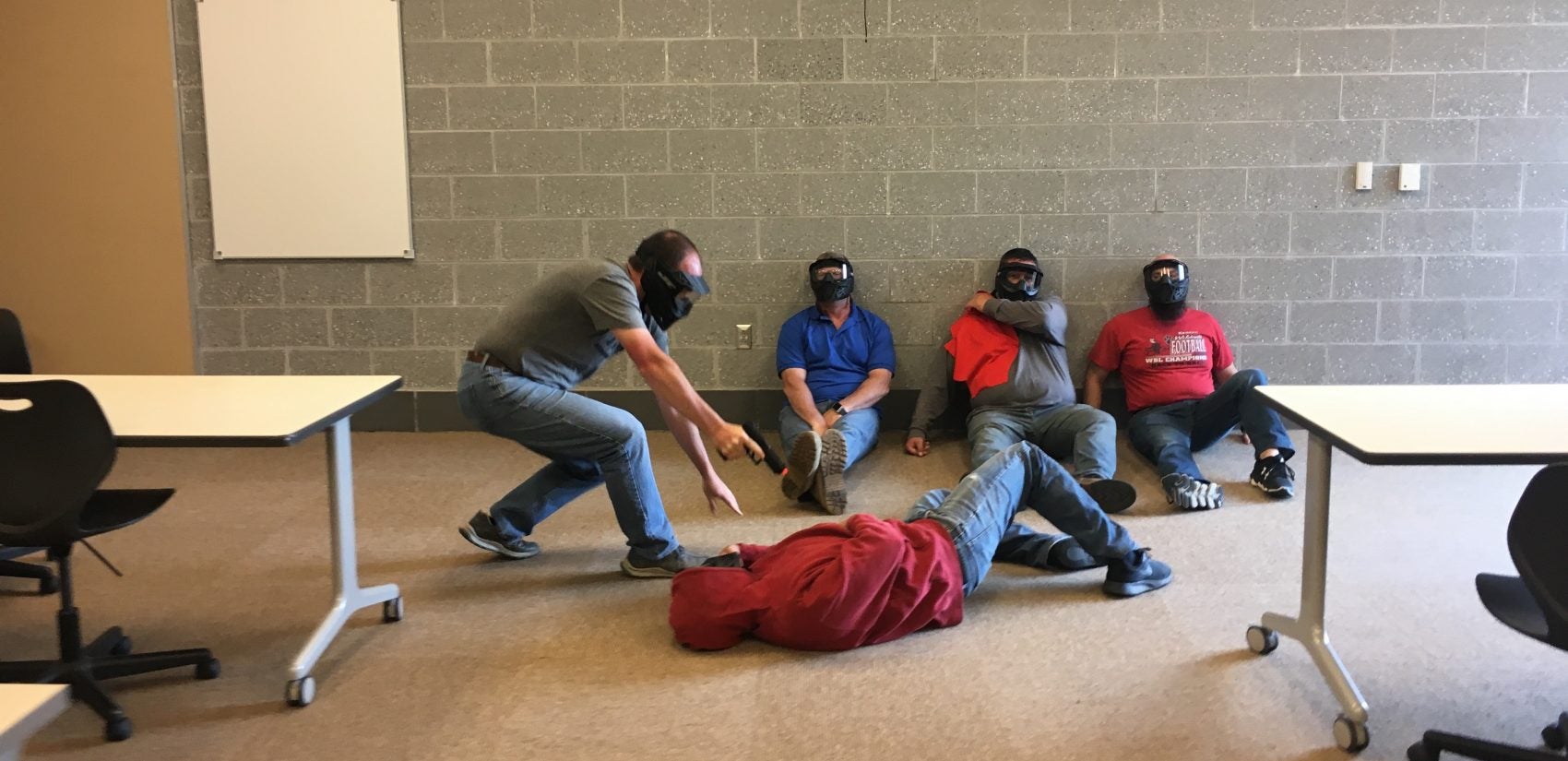 Teachers practice responding to active shooter scenarios at a high school in Ohio. Cerino tells the trainees pretending to be students, 