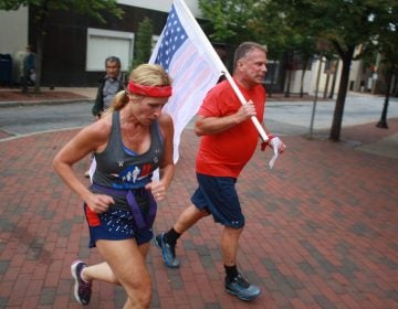 Runners head through downtown Wilmington on their way from the Pentagon to Ground Zero in New York City as part of the 243-mile 9/11 Promise Run. (Mark Eichmann/WHYY)