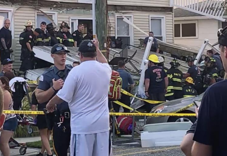 In this photo provided by James Macheda, first responders work the scene of a building structure damage in Wildwood, N.J., Saturday, Sept. 14, 2019. Multiple levels of decking attached to a building collapsed Saturday evening at the Jersey Shore, trapping people and injuring several, including children, officials and witnesses said. (James Macheda via AP)