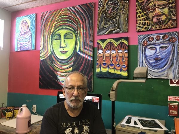 Kenneth Segal was once a member and now is on staff. He sells many of his paintings.           (Cris Barrish/WHYY)