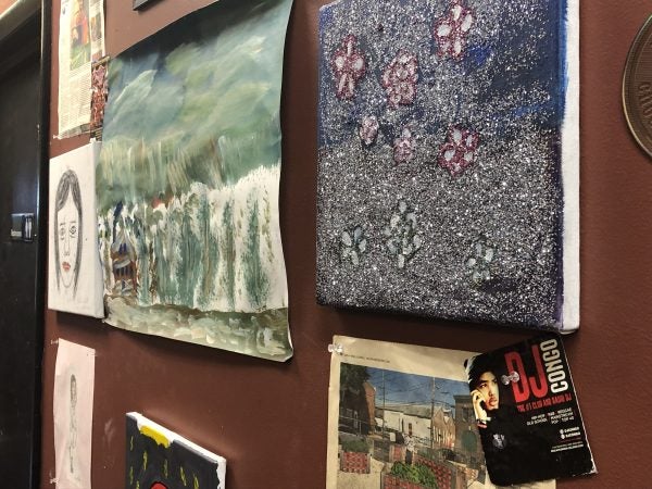 Art made by members adorns the walls of the Creative Vision Factory. (Cris Barrish/WHYY)