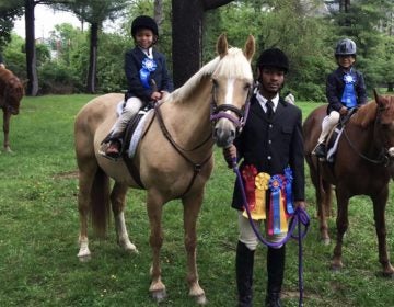 Schyler Smith, (far left), Marc Harris and Shane Woodson are some of the younger members of Work to Ride in Philadelphia's Fairmount Park. (Courtesy of Lezlie Hiner)