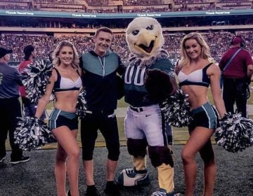 Kyle Tanguay, Swoop and two other members of the Eagles cheer squad (Twitter / @ktangkyle)