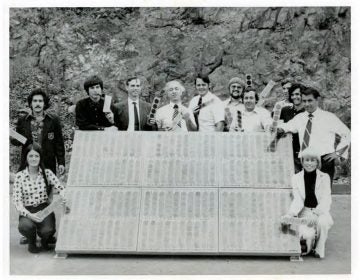 Elliot Berman (center, in patterned tie) and his team at Solar Power Corp. pose outside their office and manufacturing facility in Braintree, Mass., in 1973. John Perlin, author of Let It Shine: The 6,000-Year Story of Solar Energy, credits Berman, Solar Power Corp. and Exxon with 