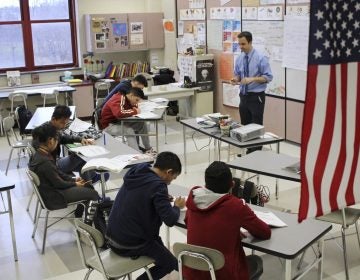 FILE PHOTO: In this Feb. 15, 2017, photo, Eric Hoover teaches his class of immigrant and refugee students at McCaskey High School in Lancaster, Pa. (Michael Rubinkam/AP Photo)