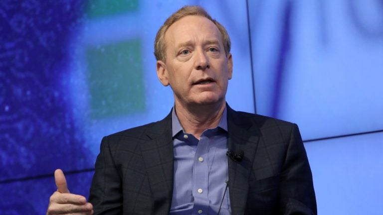 Microsoft President Brad Smith says governments need to set rules for big technology companies. 