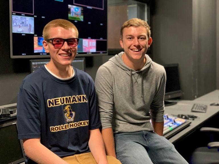 A Neumann University student videographer was surprised during a live newscast with color-corrective glasses purchased by his classmates. (Courtesy of Neumann Media)