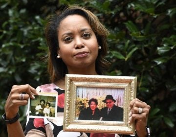 Donna Cryer holds up family photos that include her father Roland Henry. When her father died, she tried to donate his organs, yet the local organ collection agency said no, without talking to the family or providing a reason. 