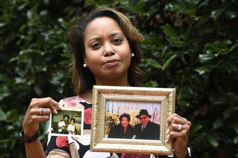 Donna Cryer holds up family photos that include her father Roland Henry. When her father died, she tried to donate his organs, yet the local organ collection agency said no, without talking to the family or providing a reason. 