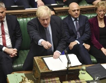Britain's Prime Minister Boris Johnson speaks to lawmakers inside the House of Commons to update details of his new Brexit deal with EU, in London. Secretary of State for Exiting the European Union, Stephen Barclay, left, and Business Secretary Andrea Leadsom, right. (Jessica Taylor/AP)
