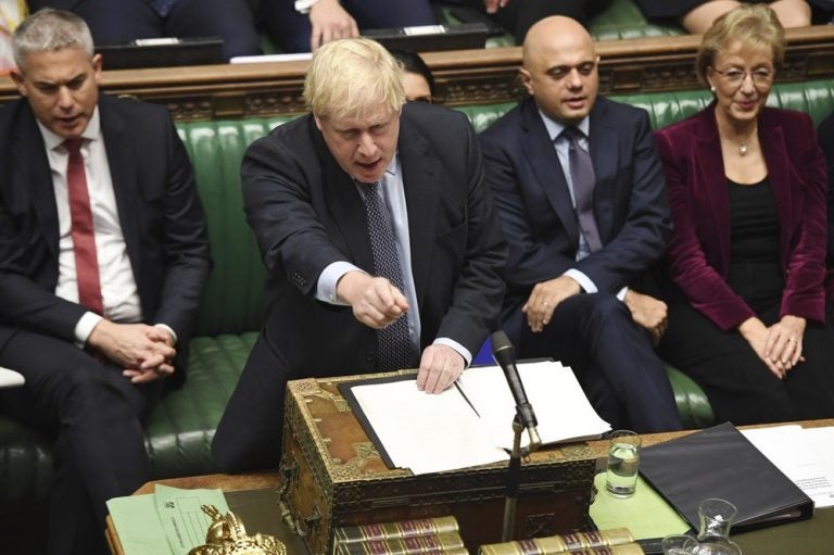 Britain's Prime Minister Boris Johnson speaks to lawmakers inside the House of Commons to update details of his new Brexit deal with EU, in London. Secretary of State for Exiting the European Union, Stephen Barclay, left, and Business Secretary Andrea Leadsom, right. (Jessica Taylor/AP)