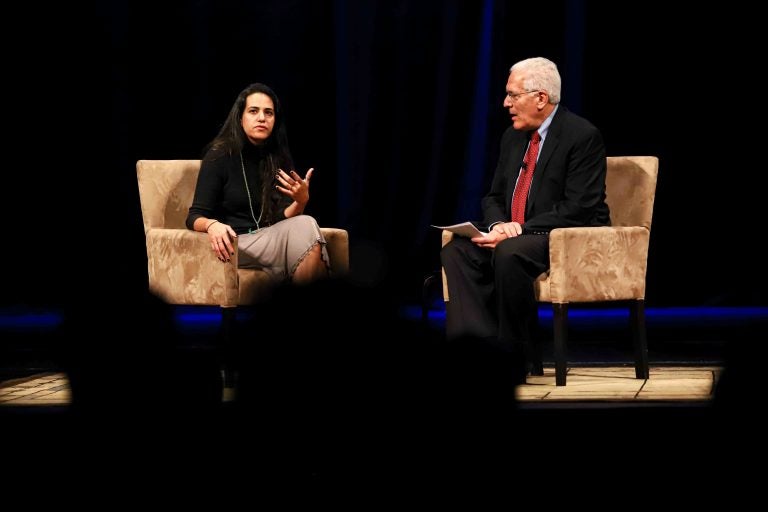 Safa Al Ahmad speaks with UD's Ralph Begleiter on Wednesday night. (Saquan Stimpson for WHYY)