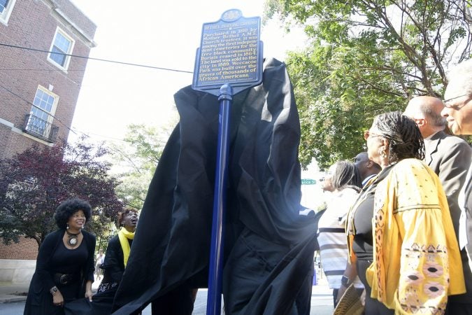 Officials and community leaders unveil the state historical marker for the Mother Bethel AME Burying Ground. (Bastiaan Slabbers for WHYY)