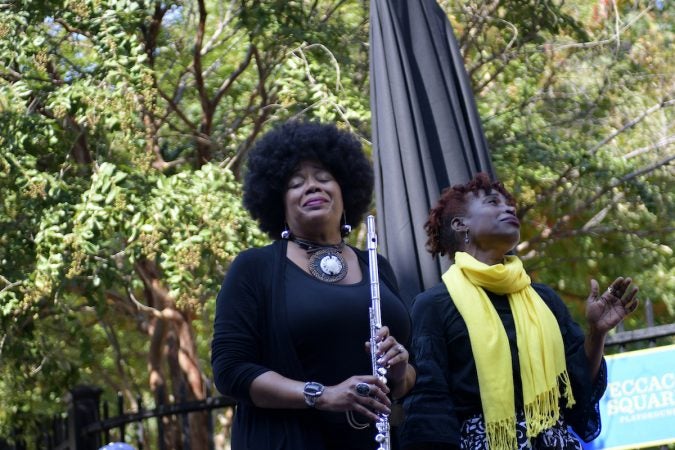 Ruth Naomi Floyd and Valerie Gay perform ahead of the unveiling of a state historical marker at the Mother Bethel AME Burying Grounds. (Bastiaan Slabbers for WHYY)