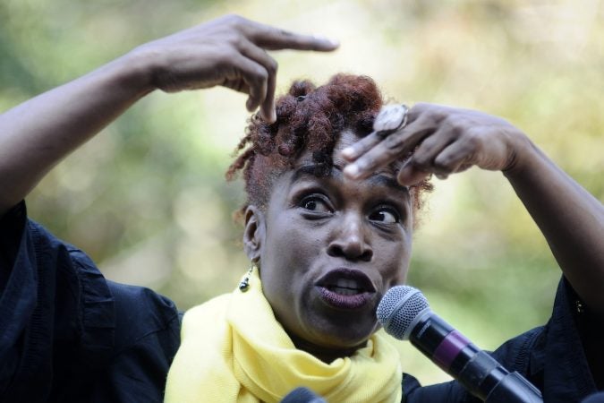 Valerie Gay of the EVER Ensemble performs ahead of the unveiling of a state historical marker at the Mother Bethel AME Burying Ground, in Queen Village, on Tuesday. (Bastiaan Slabbers for WHYY)