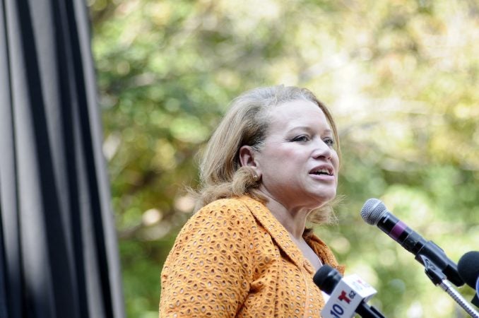 Stephanie Gilbert speaks ahead of the unveiling of a state historical marker at the Mother Bethel AME Burying Grounds, in Queen Village, on Tuesday. (Bastiaan Slabbers for WHYY)