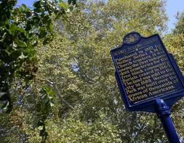 An official Pennsylvania historical marker is unveiled at the Bethel Burying Ground, located under the site of Weccacoe Playground, in Queen Village, on Tuesday. (Bastiaan Slabbers for WHYY)