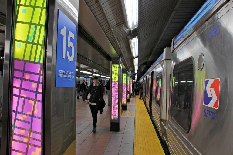 Ray King's artwork illuminates the platform of the revamped 15th Street Station. (Emma Lee/WHYY)