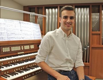 Adrian Binkley, an student at the Curtis Institute of Music in Philadelphia, has been surveying church pipe organs in churches outside Center City. (Emma Lee/WHYY)