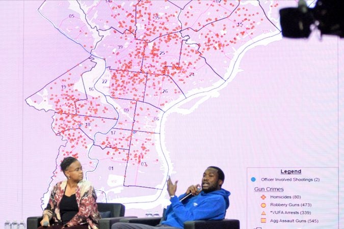 A map of gun crimes is show on the stage during the Players Coalition Town Hall on Policing in the city, at Community College of Philadelphia, on Monday. (Bastiaan Slabbers for WHYY)