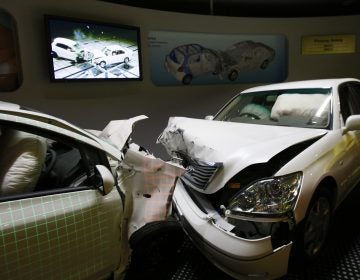 Crashed cars with airbags deployed are shown to visitors as part of the display of Toyota Motor Corp.'s safety performance standards, called 
