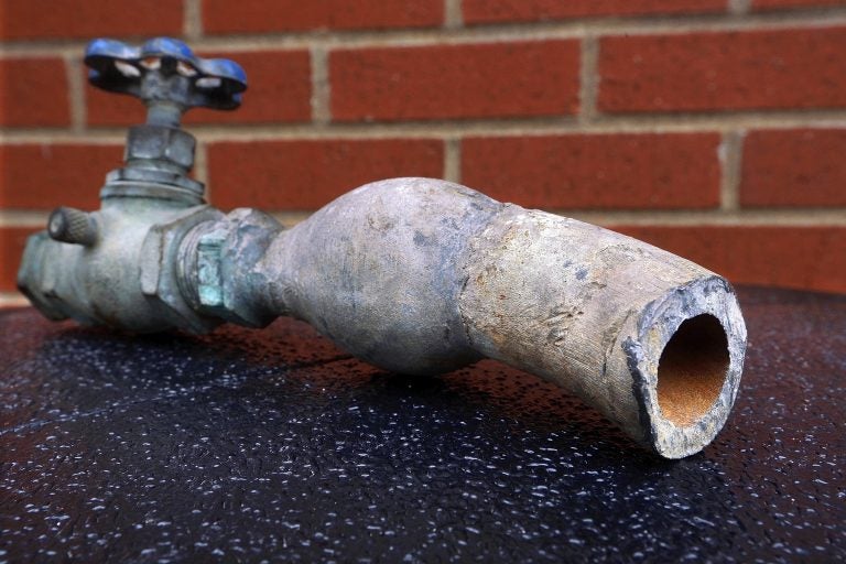 An example of lead pipes that deliver water to the nation's homes is on display. (Seth Perlman/AP Photo)