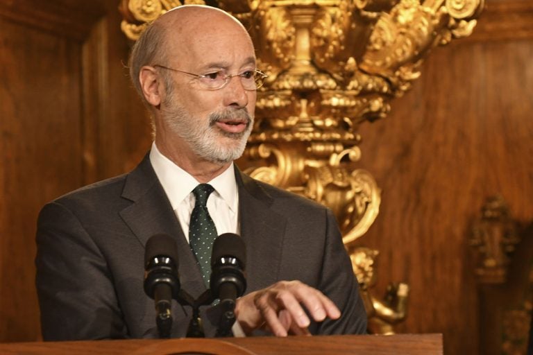 Pennsylvania Gov. Tom Wolf speaks to reporters during a news conference on his signing an executive order for his administration to start working on regulations to bring Pennsylvania into a nine-state consortium that sets a price and limits on greenhouse gas emissions from power plants, Thursday, Oct. 3, 2019 in Harrisburg, Pa. (Marc Levy/AP Photo)