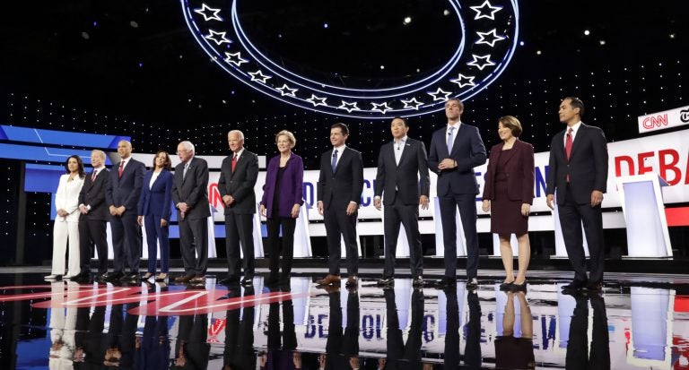 Democratic presidential candidates stand on stage for a photo before a primary debate hosted by CNN and The New York Times at Otterbein University, Tuesday, Oct. 15, 2019, in Westerville, Ohio. (Tony Dejak/AP Photo)