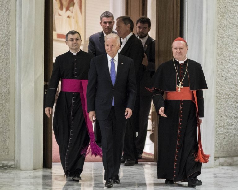 In this file photo, former Vice President Joe Biden is flanked by Cardinal Gianfranco Ravasi (right) as he arrives to attend a special audience celebrates by Pope Francis with participants at a congress on the progress of regenerative medicine and its cultural impact in the Paul VI hall in Vatican City, Vatican. (Giuseppe Ciccia/Pacific Press) 