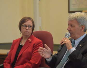 Jennifer Lugar, whose husband died by suicide with a gun in 2009, listens as state Sen. Tom Killion, R-Delaware County, speaks during a panel discussion on Oct. 1, 2019. The discussion took place at the Chadds Ford Township Municipal Building. (Ed Mahon / PA Post)