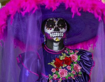 Rosa E. Ruiz wears an elaborate costume during a celebration of the Mexican tradition, Day of the Dead, at the Penn Museum in Philadelphia. (Miguel Martinez for WHYY)