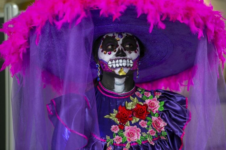 Rosa E. Ruiz wears an elaborate costume during a celebration of the Mexican tradition, Day of the Dead, at the Penn Museum in Philadelphia. (Miguel Martinez for WHYY)