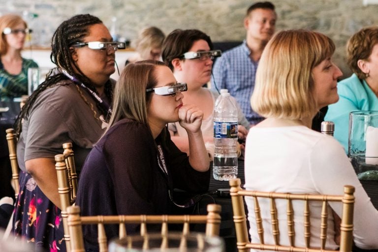 People's Light staff tries on the glasses. At the right foreground is Lisa Sonneborn, director of media arts and culture at Temple University's Institute on Disabilities, one of the partners in the project to bring the Smart Caption Glasses to the United States. (Courtesy of People's Light)